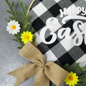 Easter wreath with black white buffalo plaid and Happy Easter text on a bamboo ring