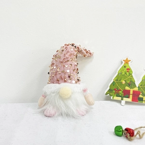 Rosa Pailletten-Weihnachtswichtel mit weißem Bart und festlicher Dekoration