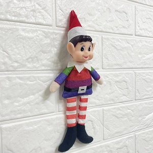 Detail of Christmas elf plush with rainbow stripes, felt body, and pointed vinyl head