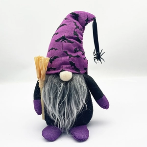 Macro view of a Halloween gnome with purple bat hat, gray beard and a tiny straw broom