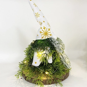 Lighted Christmas gnome tree decoration with white snowflake hat and wooden base
