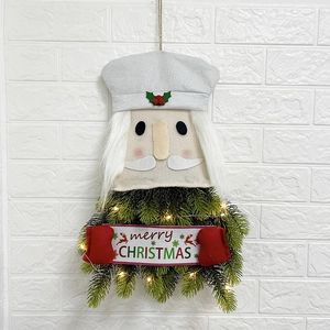 Nutcracker Christmas wreath with warm LED lights and Merry Christmas felt banner
