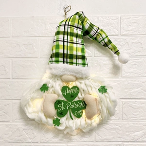 LED lighted St. Patrick's Day gnome wall hanging with clover sign and green plaid hat