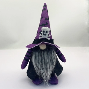 Detail of Halloween gnome plush with purple bat hat and white skull emblem