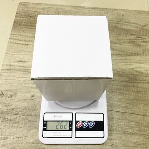 Detailed top view of a white boxed gnome doll weighing 262g on a digital scale