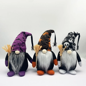 Three Halloween gnomes with bat, spider, and skull patterns holding wooden brooms
