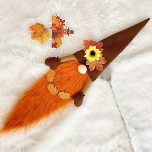 Detailed view of harvest gnome plush with sunflower hat and orange beard for Thanksgiving