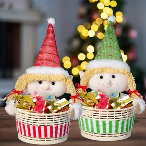 Close-up of red and green Christmas elf plush dolls sitting in gift-filled woven baskets
