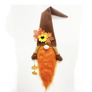 Detail of harvest gnome wreath with sunflower, maple leaves and small pumpkins