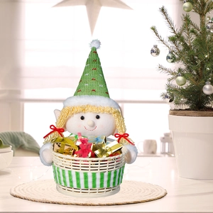 Christmas elf doll holding a white woven candy storage basket for festive table decoration