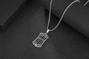 Close-up of vintage titanium steel abacus pendant with lucky clouds and wealth character