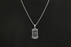Detailed view of vintage abacus pendant necklace in titanium steel with Zhaocai engraving