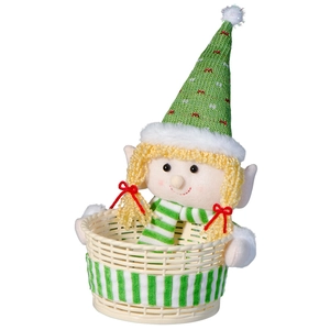Detail of Christmas elf character with green hat and scarf holding a woven candy basket