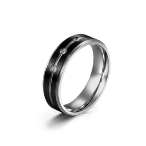 Polished stainless steel ring with black brushed band and three inlaid crystals
