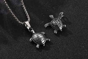 Macro view of vintage stainless steel sea turtle pendants with detailed shell texture