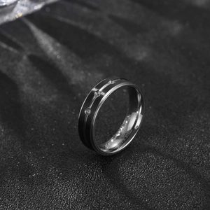 Minimalist stainless steel ring with black and silver split tone and inlaid diamonds