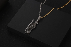 Detailed view of vintage Saint Mary pendant necklaces in gold and silver finish