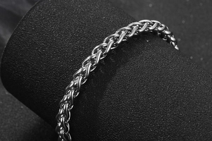 Macro shot of silver Spiga chain link bracelet with polished stainless steel finish