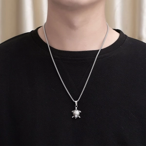 Minimalist stainless steel turtle pendant necklace for men and women on a round box chain