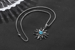 Close-up of retro titanium steel necklace with blue evil eye and starburst pendant detail