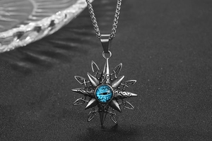 Macro shot of titanium steel star pendant with a blue evil eye on dark background