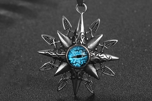 Macro shot of retro star pendant with blue evil eye detail and embossed metal textures