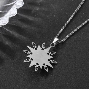Vintage silver starburst sun pendant necklace in titanium steel with woven wheat chain design