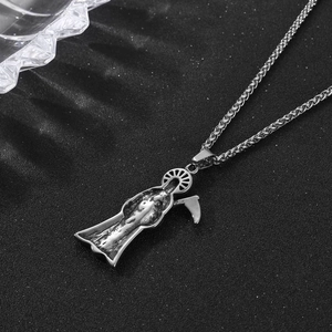 Retro stainless steel Grim Reaper necklace with scythe pendant on black matte background