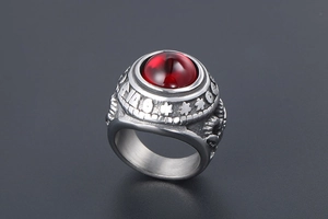 Macro view of vintage titanium steel ring with red agate and engraved 146 symbol