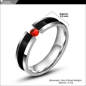 Detailed close-up of a titanium steel ring with black enamel and a red zircon stone