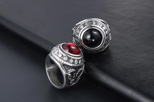 Detailed close-up of retro titanium steel rings with red and black agate stones