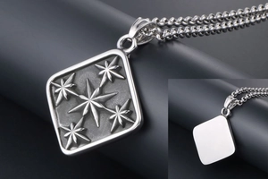 Macro view of vintage titanium steel square star pendant with textured starburst details