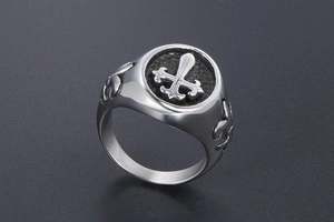Detail of gothic stainless steel cross ring with embossed fleur-de-lis and black finish
