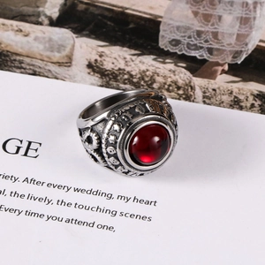 Vintage titanium steel ring with large red agate cabochon and embossed star patterns
