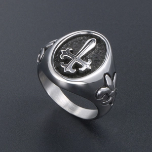 Retro titanium steel signet ring for men featuring cross fleur-de-lis motif on grey surface