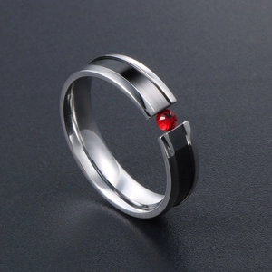 Titanium steel ring with black inner band and red tension-set cubic zirconia