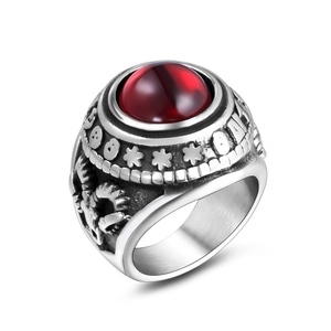 Vintage steel ring with red cat-eye stone, featuring side eagle and star engravings