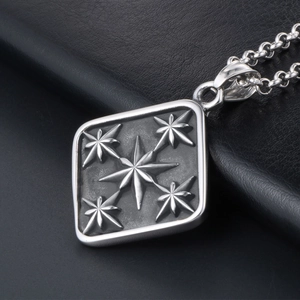 Vintage steel square pendant featuring an embossed eight-pointed star on leather