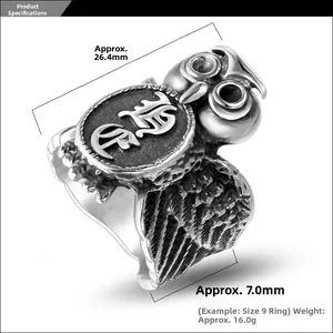 Detailed view of vintage steel owl ring featuring round relief totem and feather textures