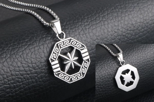 Close-up of octagonal stainless steel star pendant with detailed Greek key pattern