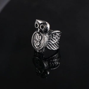 Vintage owl ring for men in stainless steel with intricate feather textures and retro charms