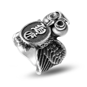 Vintage owl ring for men in retro silver finish with Sanskrit engraving on a white background