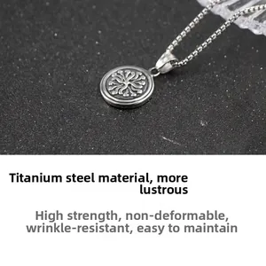 Macro view of stainless steel sunburst pendant necklace with high-gloss square pearl chain