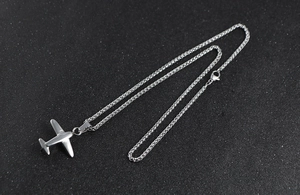 Polished stainless steel P51 Mustang fighter plane pendant on a durable wheat chain
