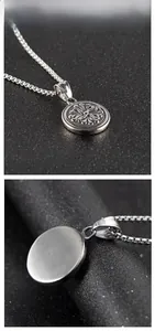 Macro view of stainless steel round medal pendant with radial patterns and brushed back texture