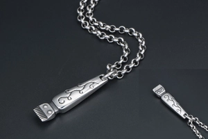 Detailed close-up of retro silver clipper pendant with textured industrial finish