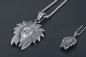Detailed view of vintage tribal Indian chief portrait pendant with oxidized finish