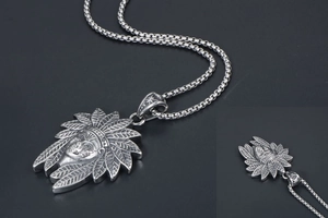 Macro shot of Indian chief portrait pendant with detailed vintage silver feathers