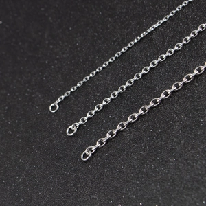 Three widths of silver stainless steel O-link chains on a black textured background