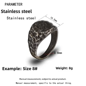 Detail view of vintage stainless steel men's ring with hammered texture and dimensions
